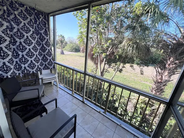 a view of balcony with wooden floor