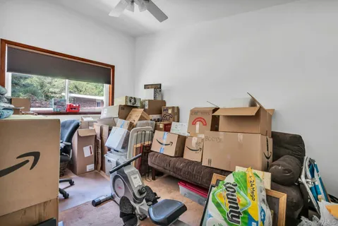 a room with gym equipment and a large window