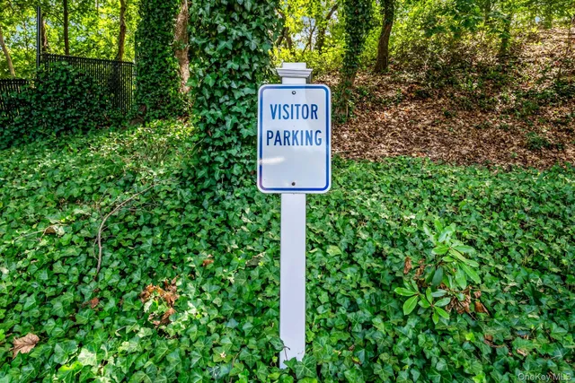 a sign on the side of the tree