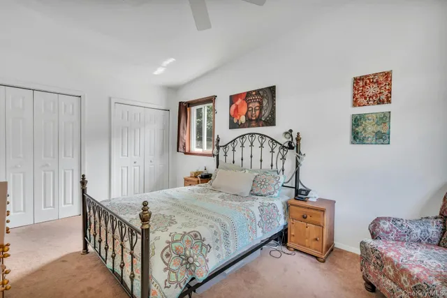 a bedroom with furniture and a window