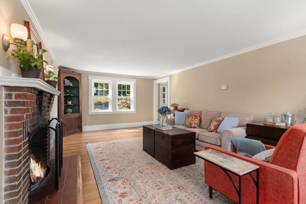19 Main Street Dover, MA 02030 - Photo 13 of 41 a living room with furniture a flat screen tv and a fireplace