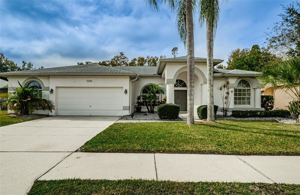 front view of a house with a yard