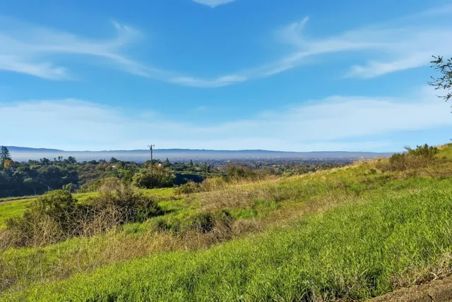 a view of an ocean and mountains