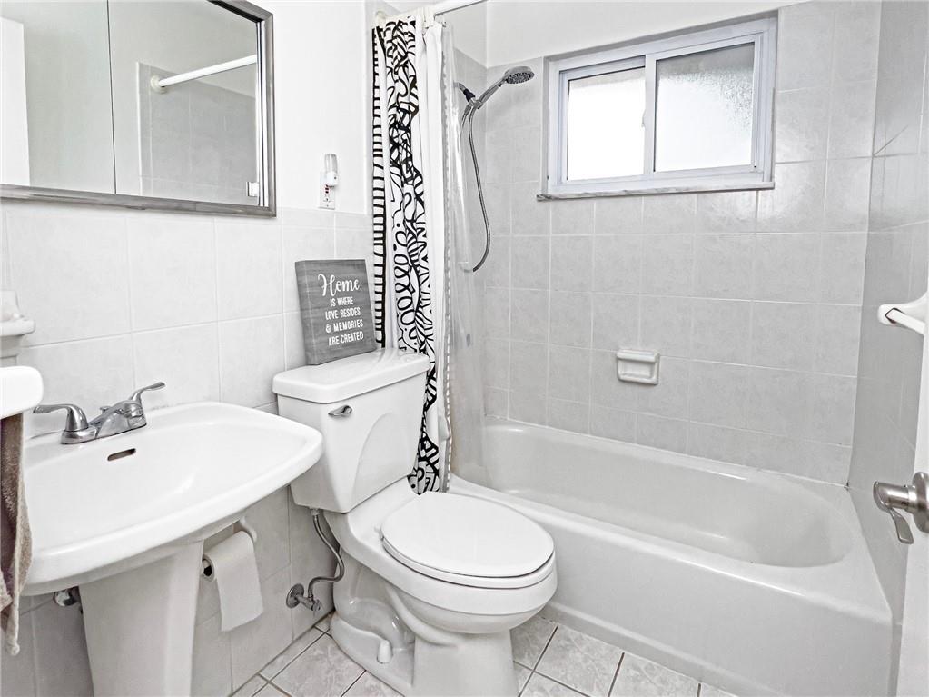 411 Colonial Drive Monroeville, PA 15146 - Photo 20 of 39 a bathroom with a sink a toilet and a bathtub