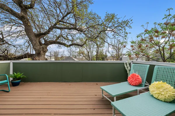 a view of a patio with a table chairs and a potted plant