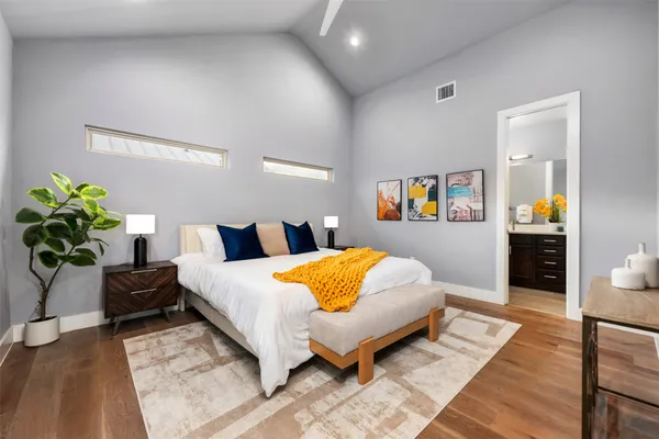 a bedroom with a bed and lamp