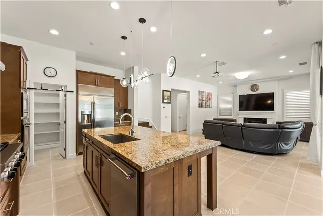 a kitchen with cabinets appliances and a counter space