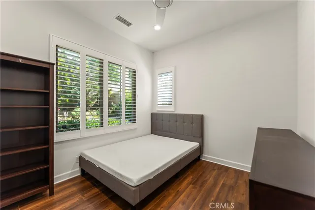a view of a chairs and table in the backyard