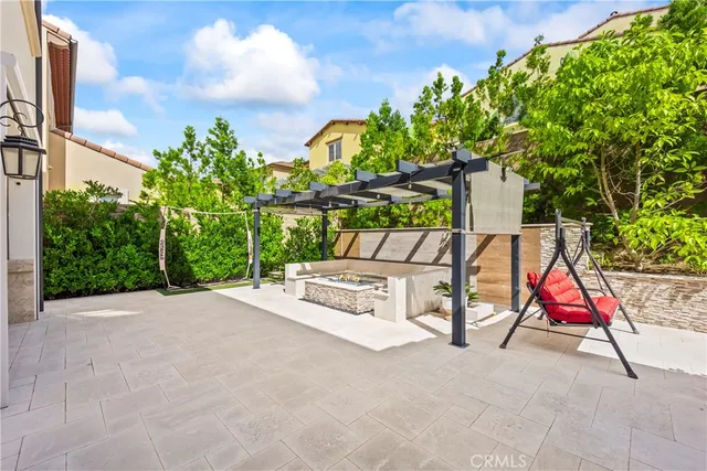 a kitchen with stainless steel appliances a stove a sink and a refrigerator with wooden floor