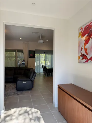 a living room with furniture and a rug