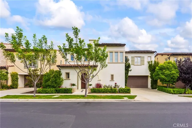 an aerial view of a house with a yard and garden
