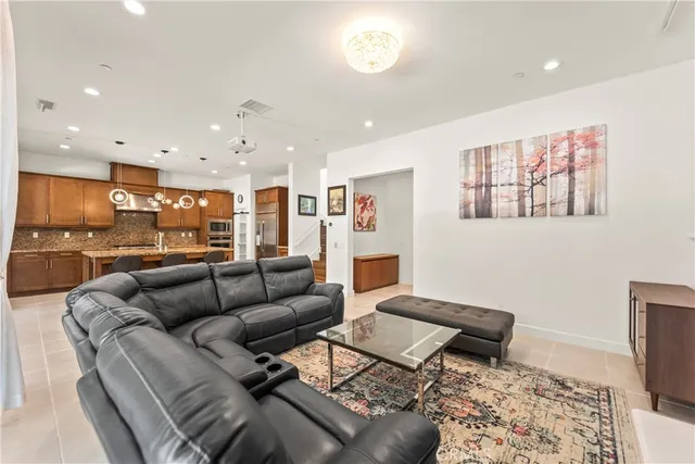 a living room with furniture and a rug
