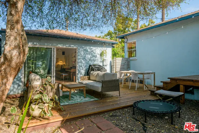a outdoor living space with furniture and a fireplace