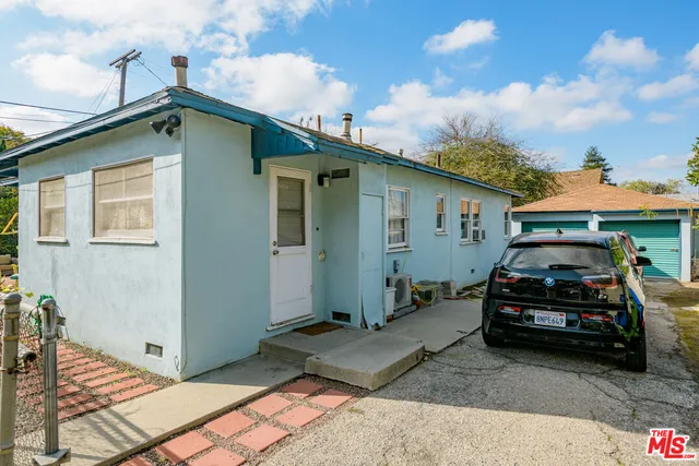 a car parked in front of a house