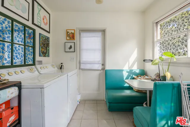 a bathroom with a sink mirror and toilet