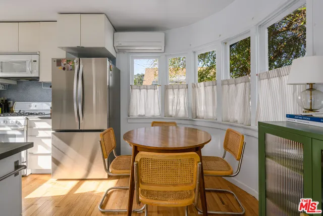 a kitchen with sink and refrigerator