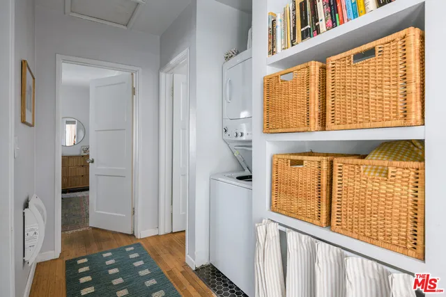 a view of hallway with wooden floor and staircase