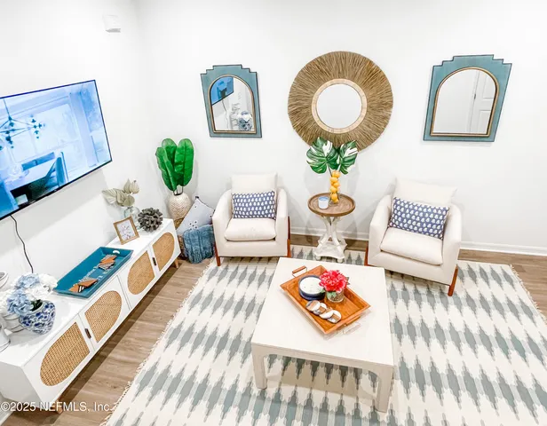a living room with furniture and rug