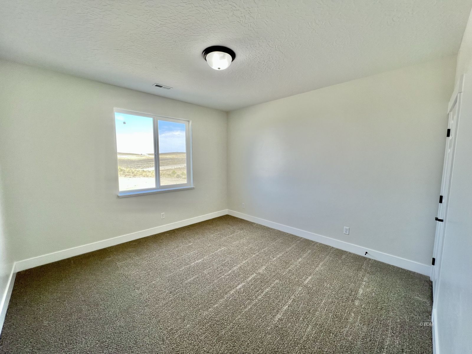 610 Ridgeway Drive Spring Creek, NV 89815 - Photo 15 of 33 an empty room with a window