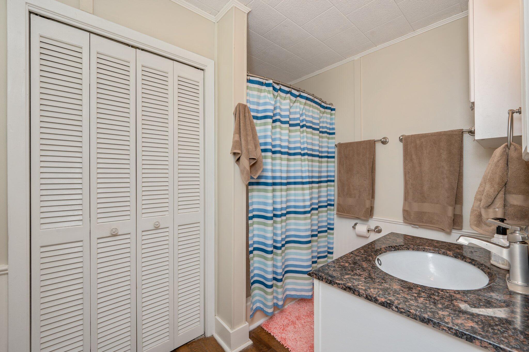 2288 Caton Road Florala, AL 36442 - Photo 28 of 47 a bathroom with a granite countertop sink and a mirror