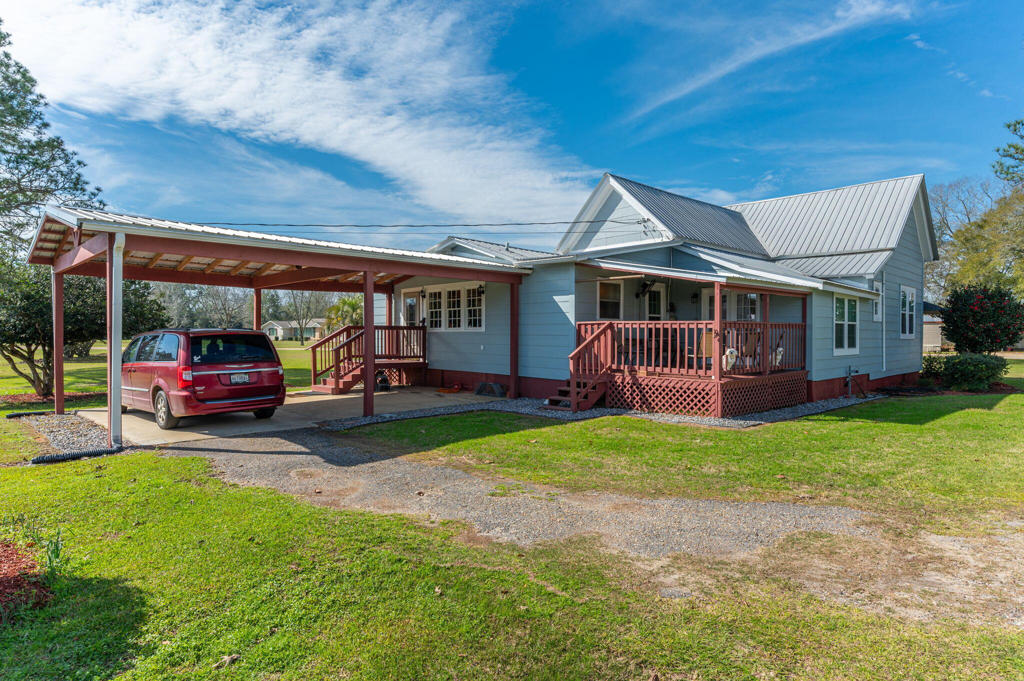 2288 Caton Road Florala, AL 36442 - Photo 35 of 47 a view of a house with a patio and a yard