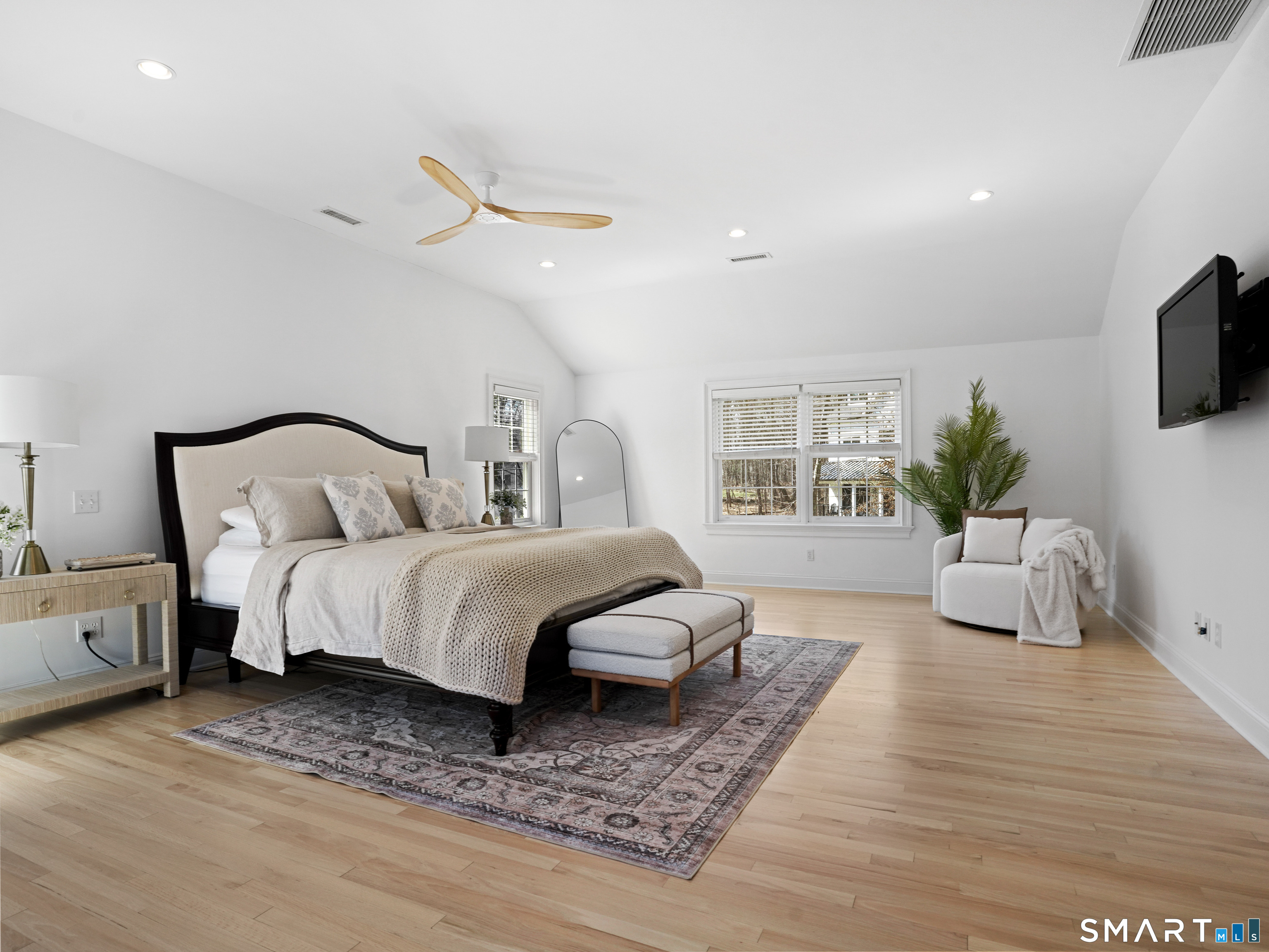 10 Reimer Road Westport, CT 06880 - Photo 11 of 38 a bedroom with a large bed and a couch