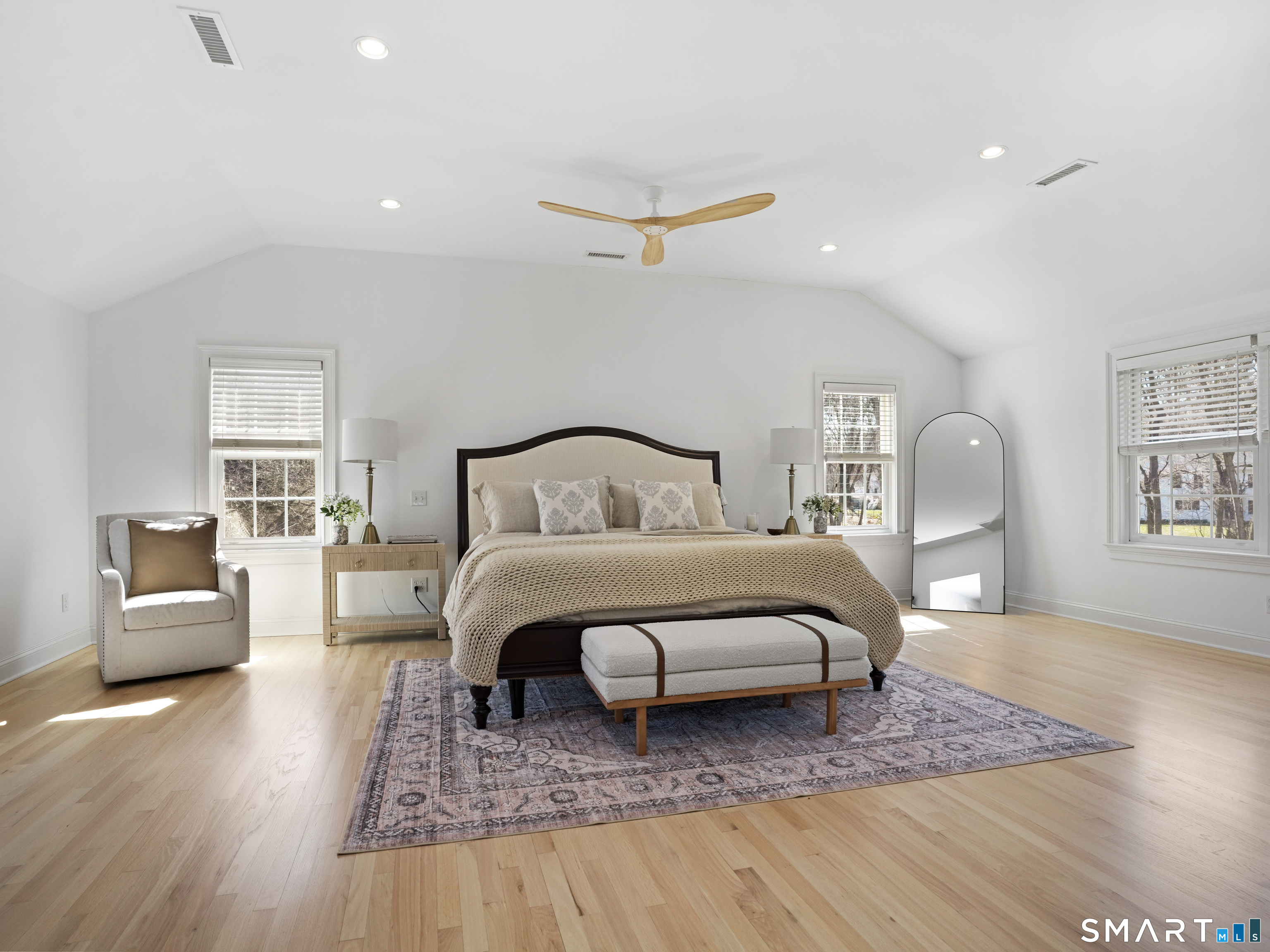 10 Reimer Road Westport, CT 06880 - Photo 13 of 38 a bedroom with a bed large mirror and couch