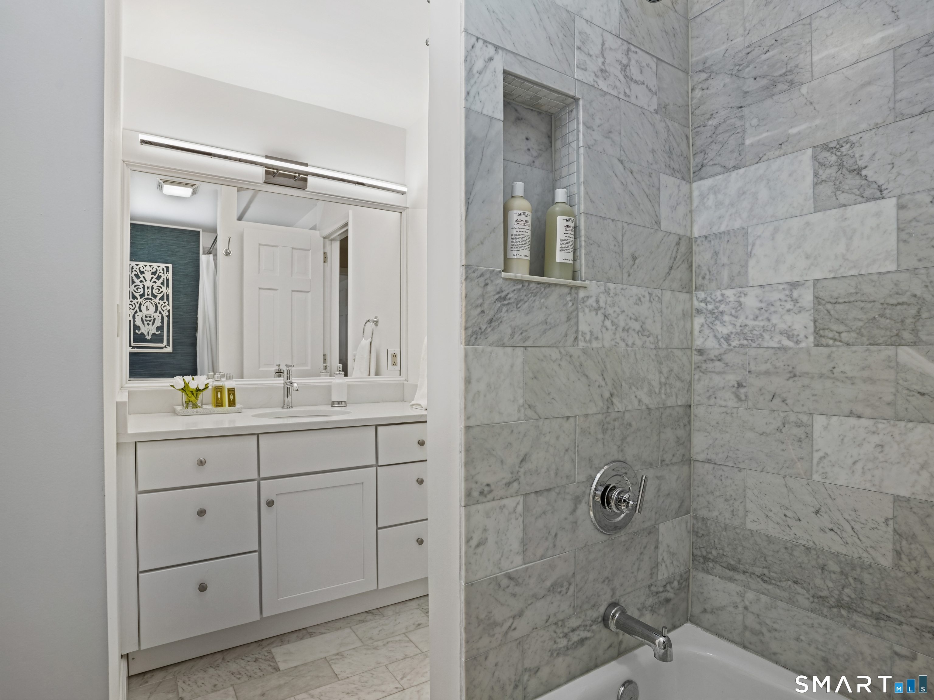10 Reimer Road Westport, CT 06880 - Photo 21 of 38 a bathroom with a double vanity sink mirror and shower