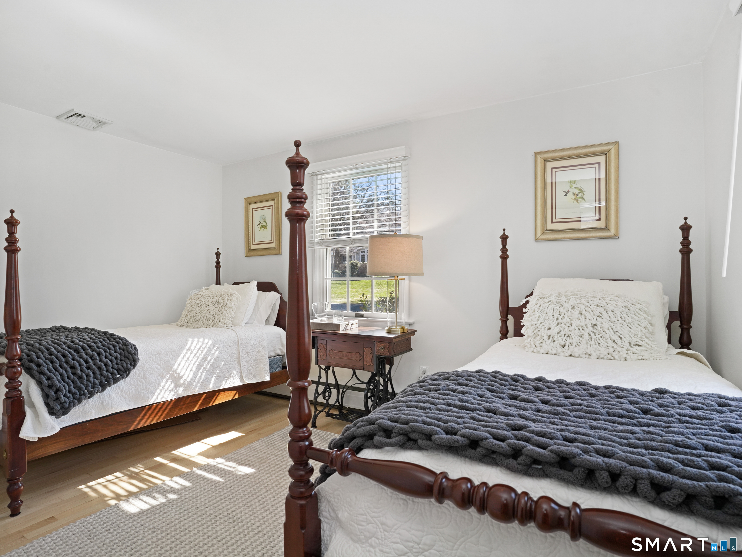 10 Reimer Road Westport, CT 06880 - Photo 22 of 38 a bedroom with a bed and wooden floor