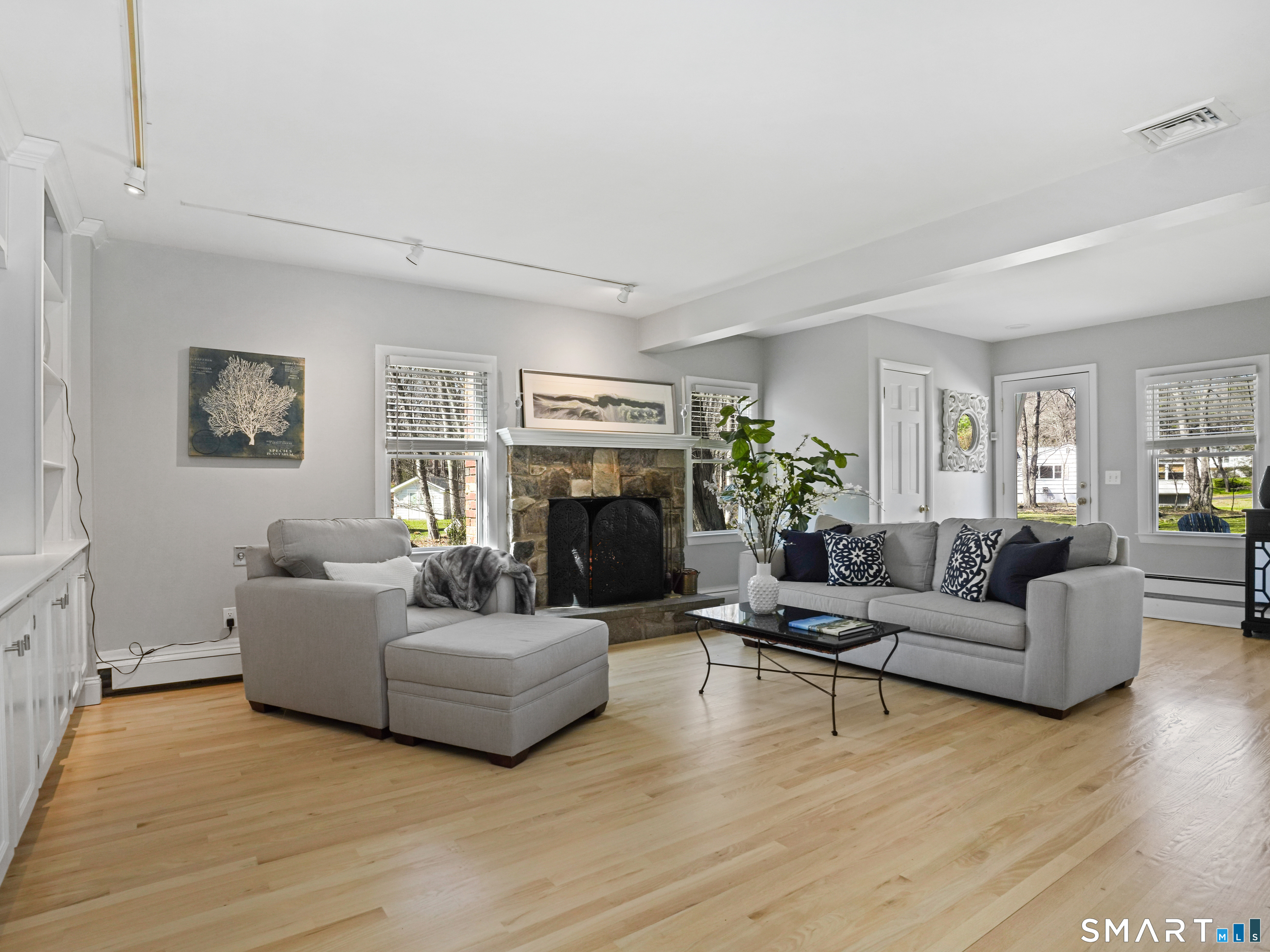 10 Reimer Road Westport, CT 06880 - Photo 25 of 38 a living room with furniture a fireplace and a window