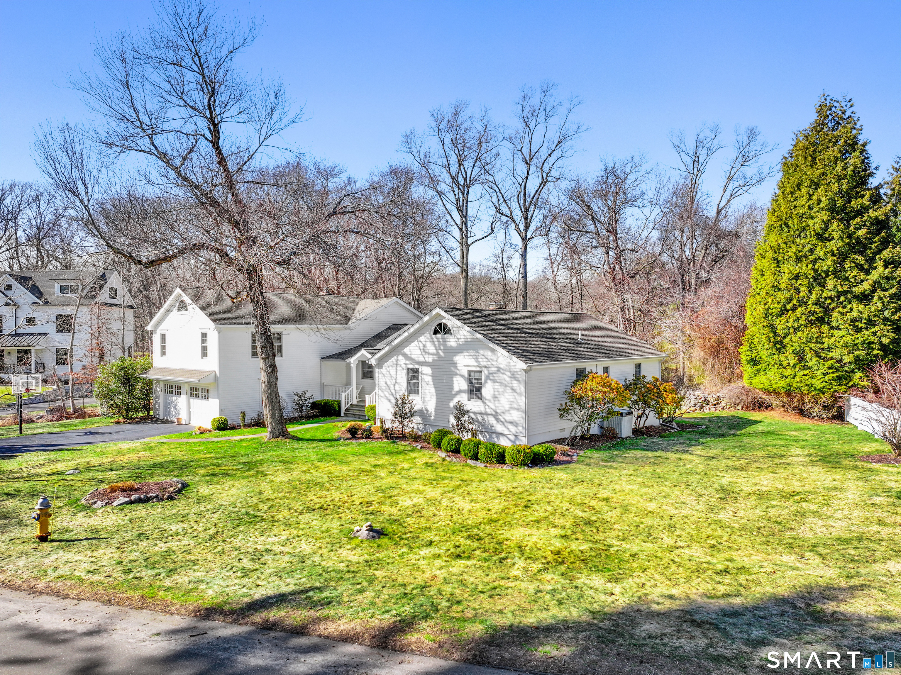10 Reimer Road Westport, CT 06880 - Photo 31 of 38 a front view of house with yard and green space