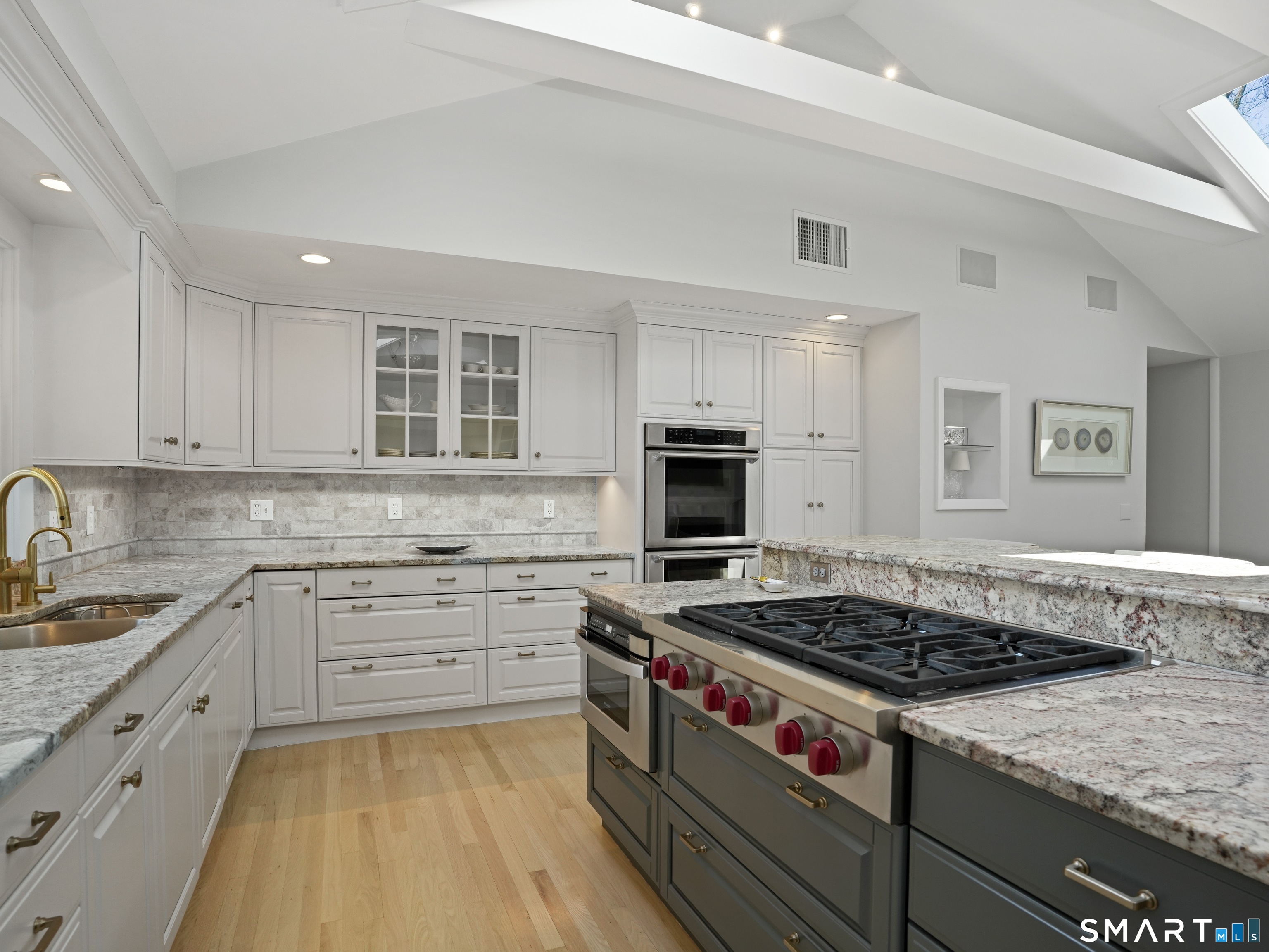 10 Reimer Road Westport, CT 06880 - Photo 4 of 38 a kitchen with stainless steel appliances granite countertop a stove and a sink