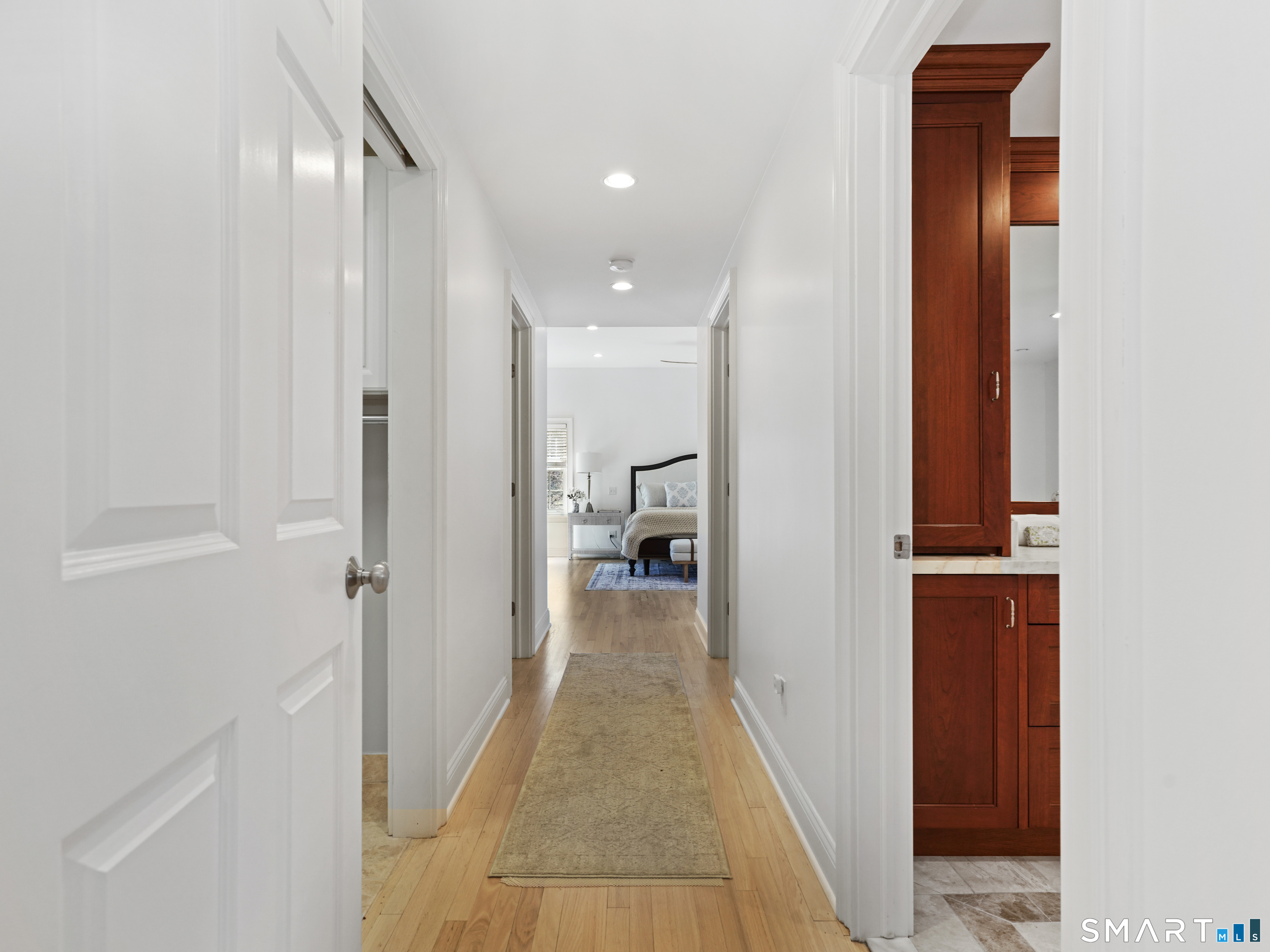 10 Reimer Road Westport, CT 06880 - Photo 10 of 38 a view of a hallway with wooden floor and a bathroom