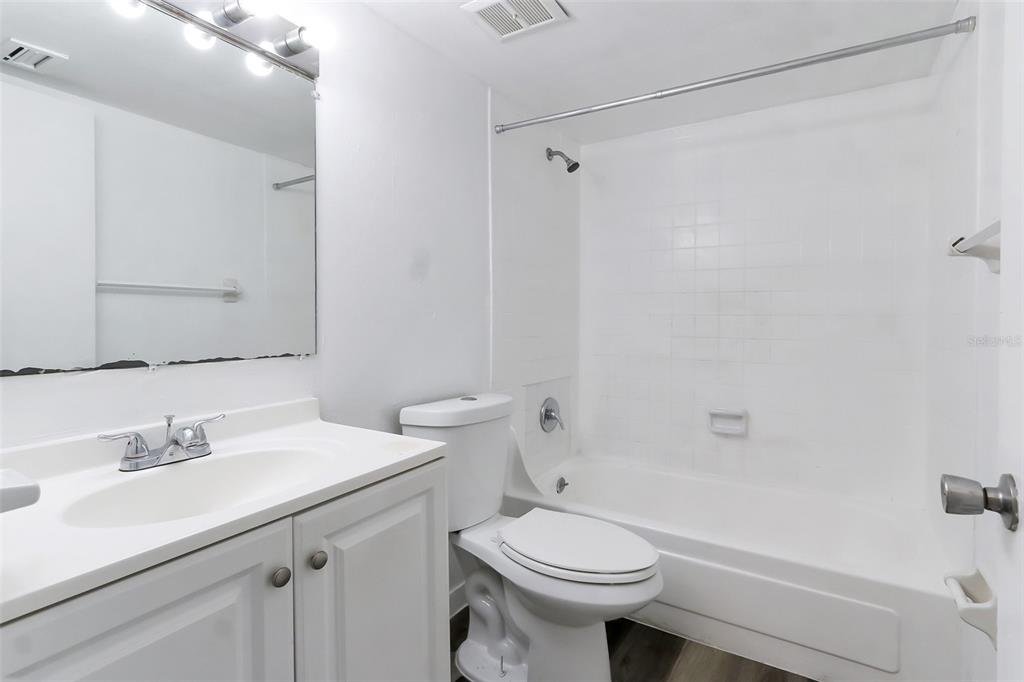 5317 Curry Ford Road, Unit J102 Orlando, FL 32812 - Photo 11 of 24 a bathroom with a sink toilet and shower