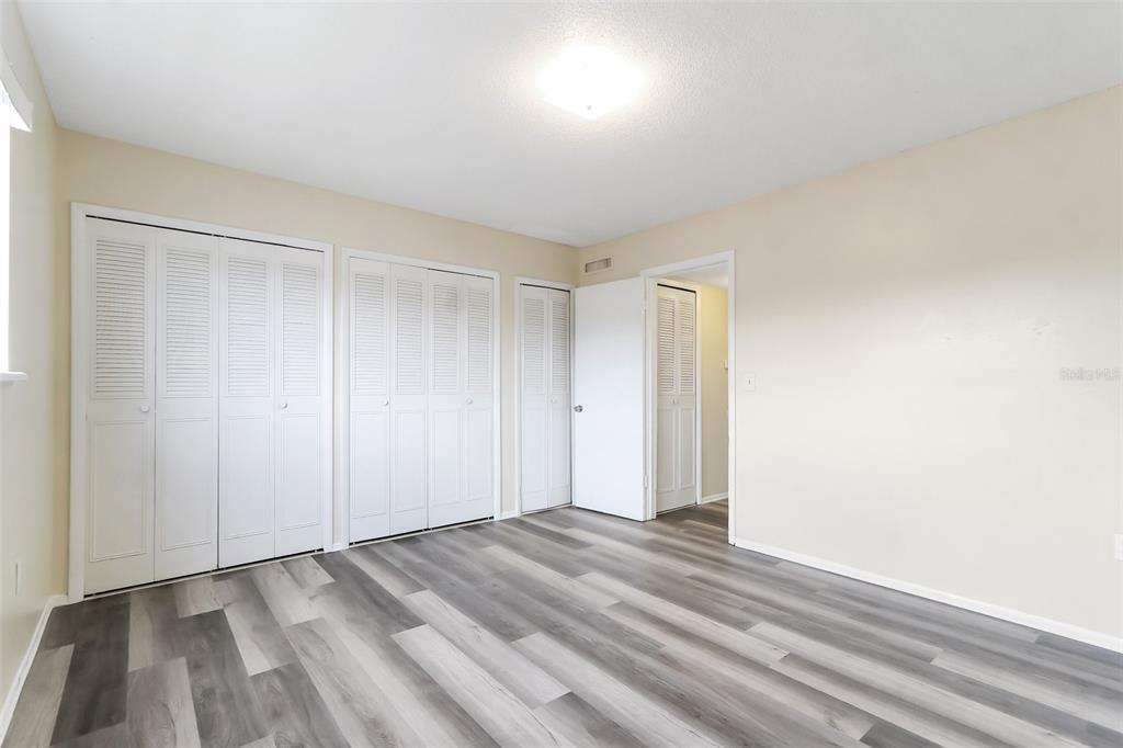 5317 Curry Ford Road, Unit J102 Orlando, FL 32812 - Photo 21 of 24 a view of room with wooden floor