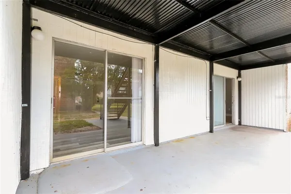 a view of backyard with large windows