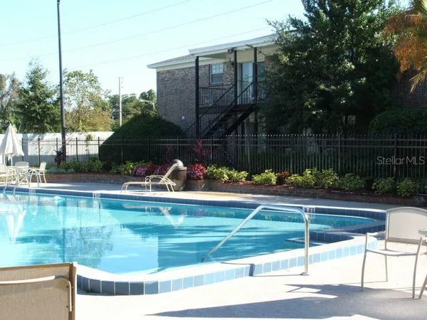 a view of swimming pool from a lake view
