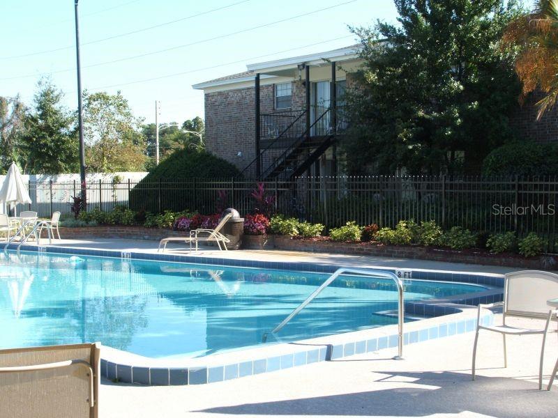5317 Curry Ford Road, Unit J102 Orlando, FL 32812 - Photo 5 of 24 a view of swimming pool from a lake view