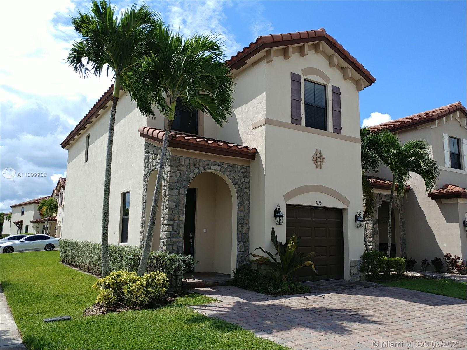 3778 Northeast 2nd Street Homestead, FL 33033 - Photo 3 of 15 a front view of a house with a yard