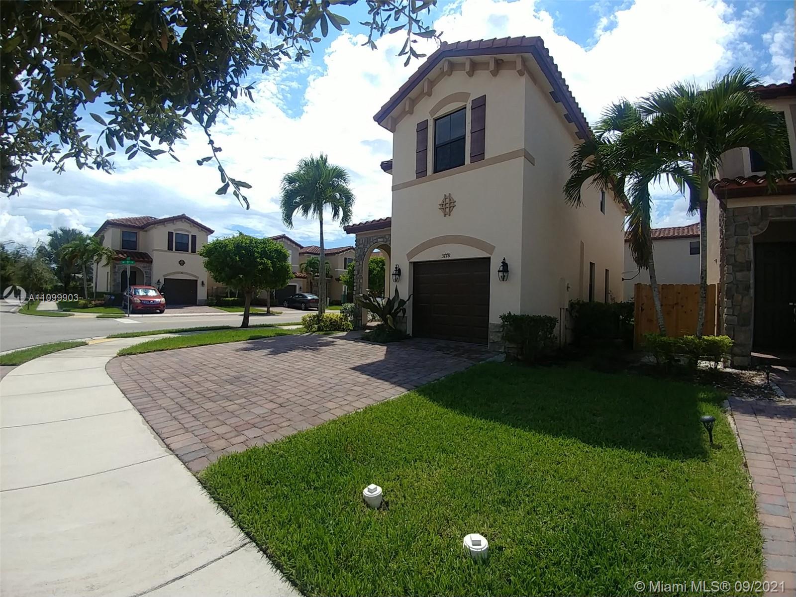3778 Northeast 2nd Street Homestead, FL 33033 - Photo 4 of 15 a front view of house with yard and green space