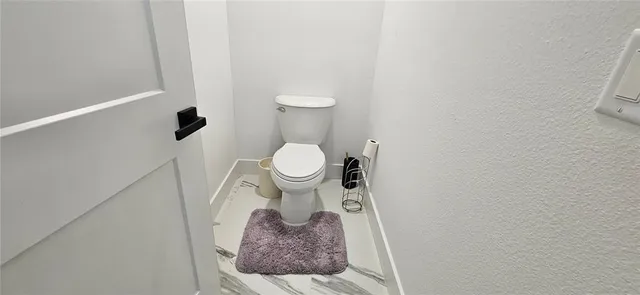 a close up of a toilet and a sink