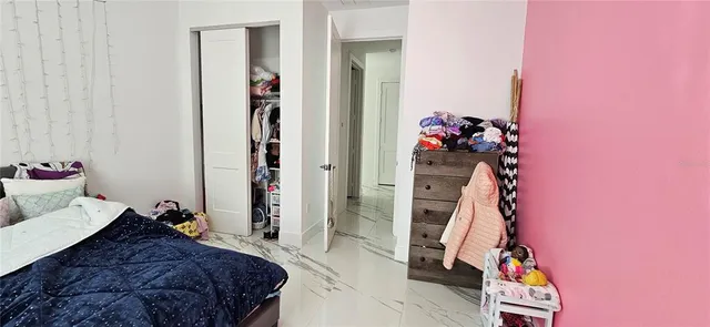 a bed room with a bed and a couch