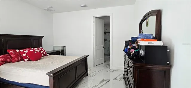 a kitchen with a refrigerator and a stove