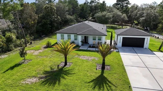 a view of house with garden