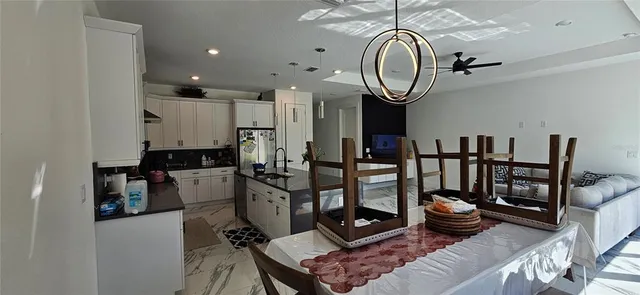 a living room with furniture a air conditioner and a fireplace