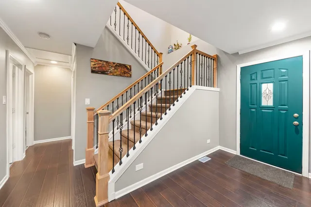 a view of staircase with wooden floor and stairs