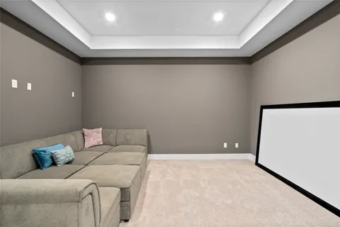 a bathroom with a granite countertop sink a toilet and shower