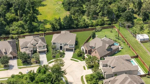 an aerial view of a house with a garden