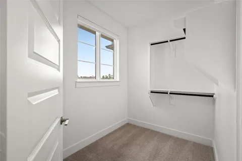 a bathroom with a granite countertop sink vanity mirror and a