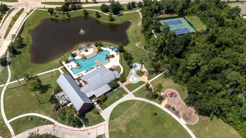 a living room with fireplace furniture and a large window